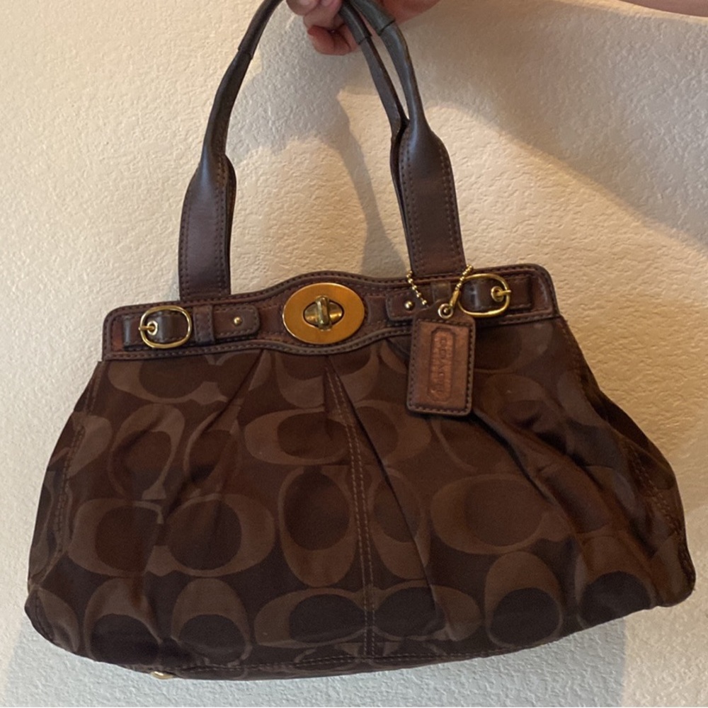 Chocolate brown COACH purse with matching chocolate brown COACH wallet.